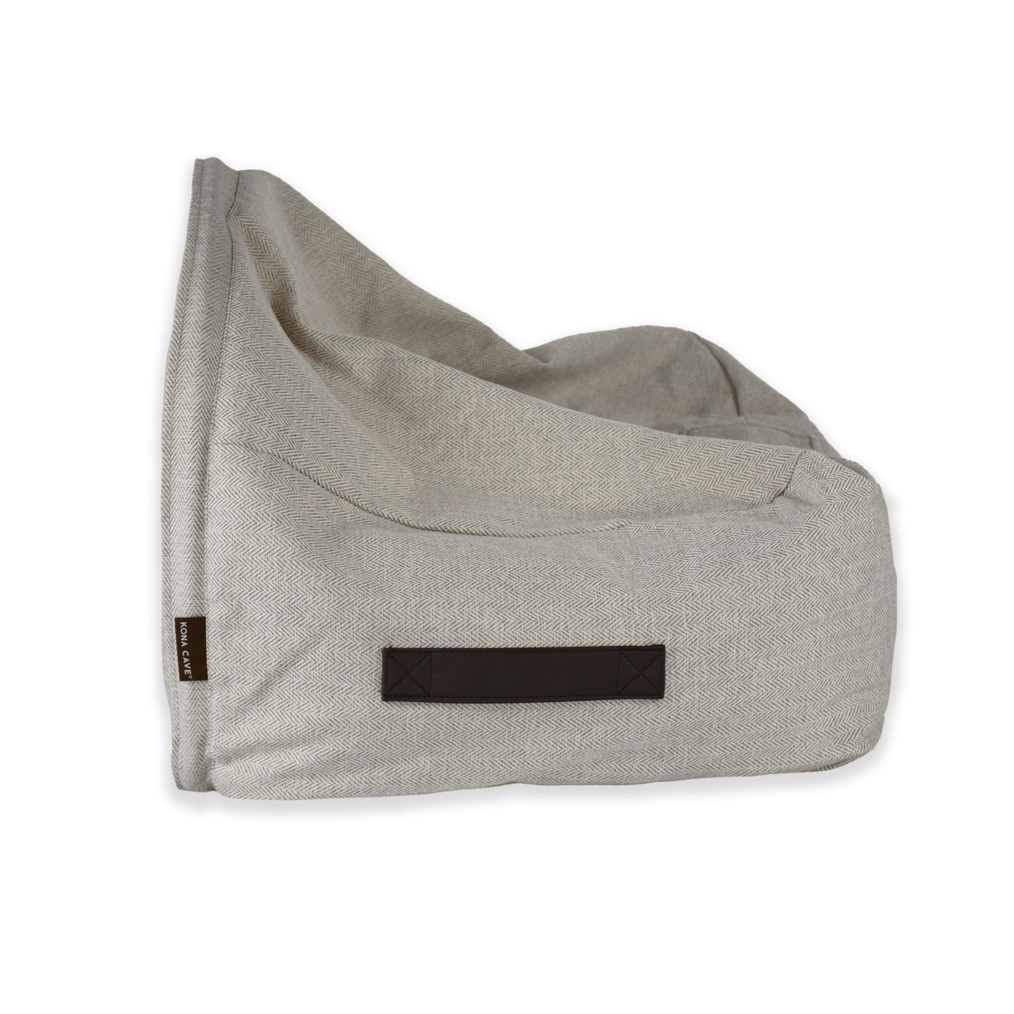 KONA CAVE® luxury dog and cat snuggle cave bed in cream herringbone. The back of the canopy cave covers lies on the bed to snuggle pets like a blanket.