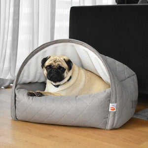 Sleepy Fox® luxury snuggle cave bed, hundehöhle, for dogs.  Shown with beautiful  fawn pug under domed den in front of dark grey velvet B&B Italia sofa.