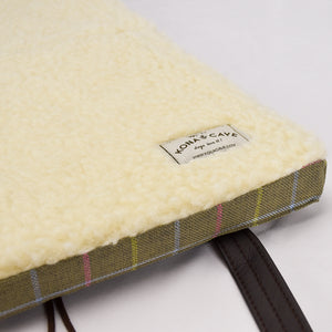 KONA CAVE® Folded Travel Dog Bed for restaurants, cars, pubs and hotels.  KONA CAVE® Travel Dog Bed with 100% natural sheared sheep's wool lining that regulates temperature and is great for scratching noses on!